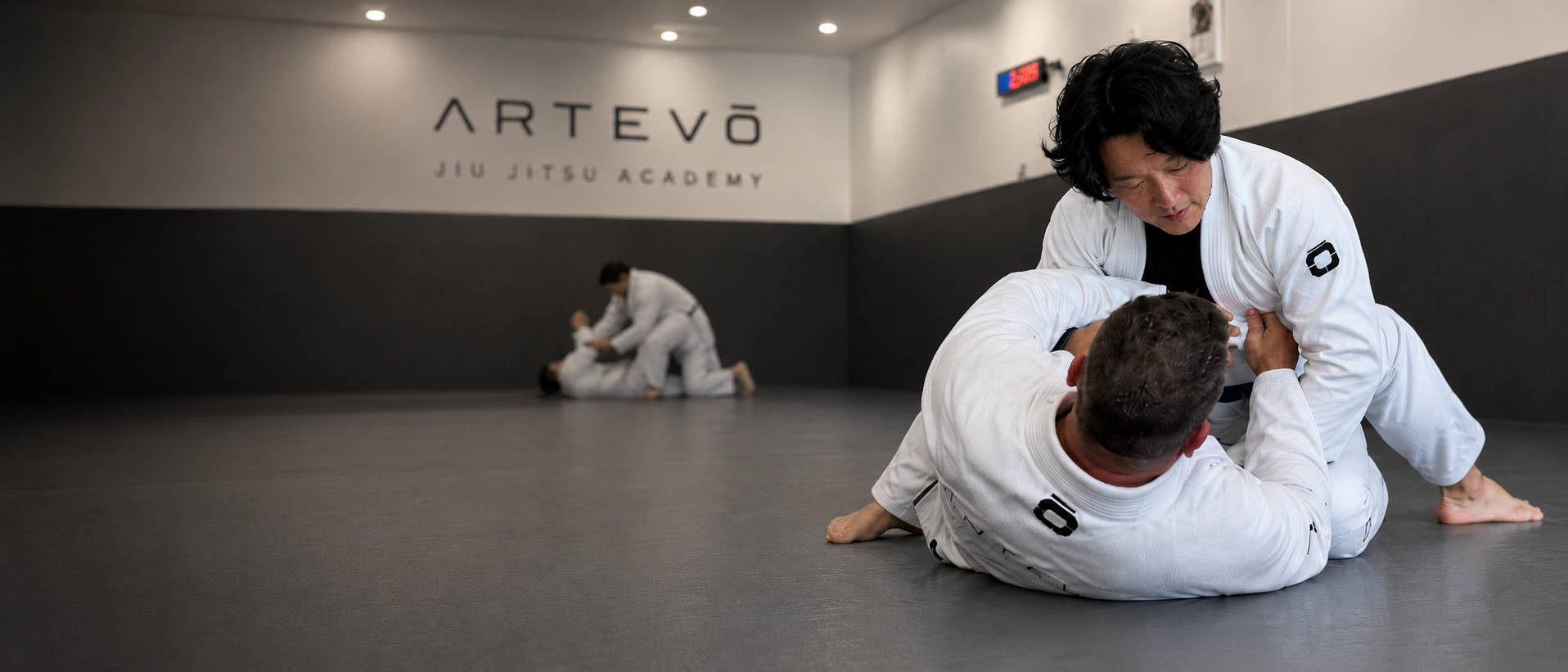 Rolling on the mats at Artevō Jiu Jitsu Academy, Buderim