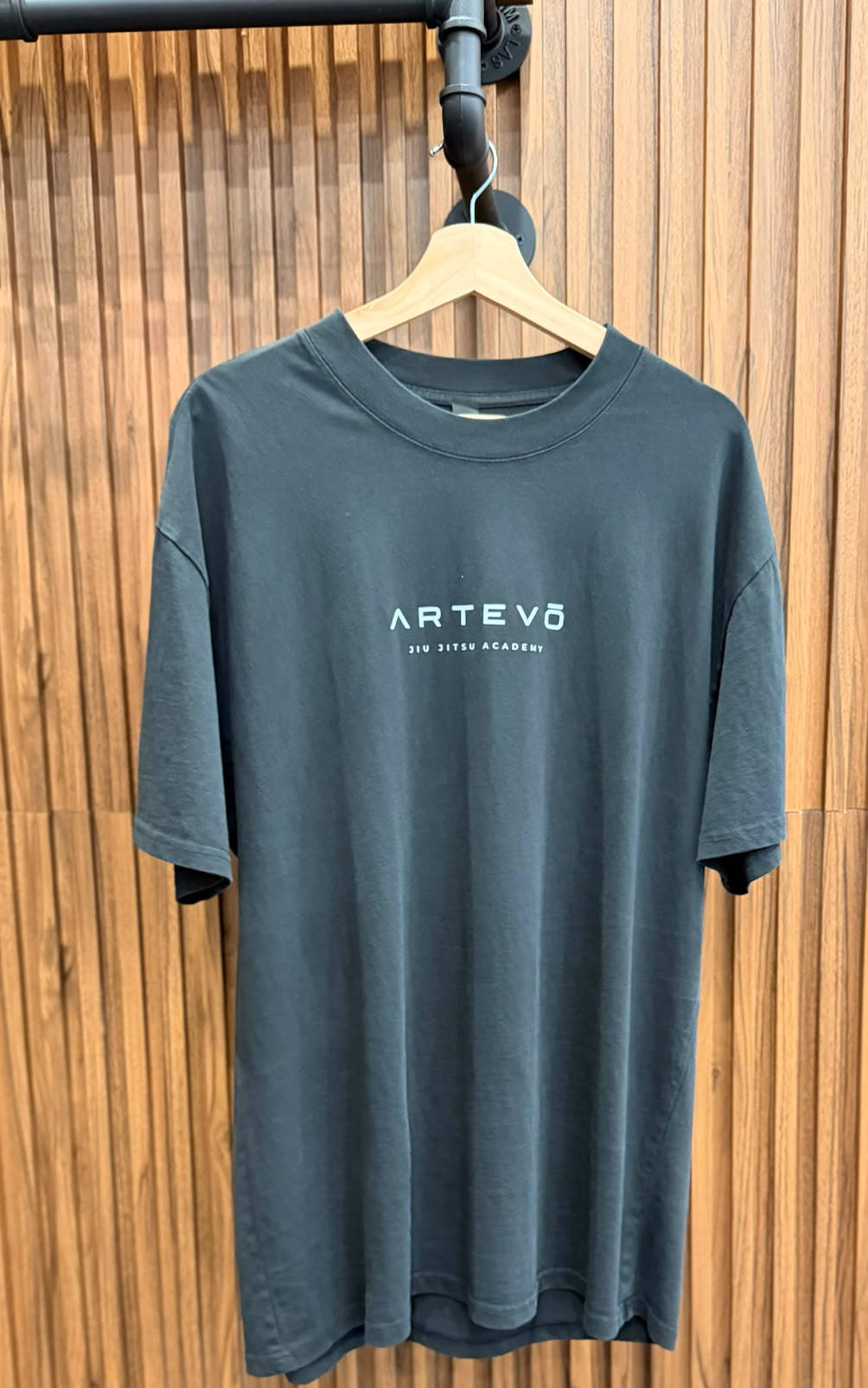 Faded black BJJ tee with Artevō Jiu Jitsu Academy chest logo